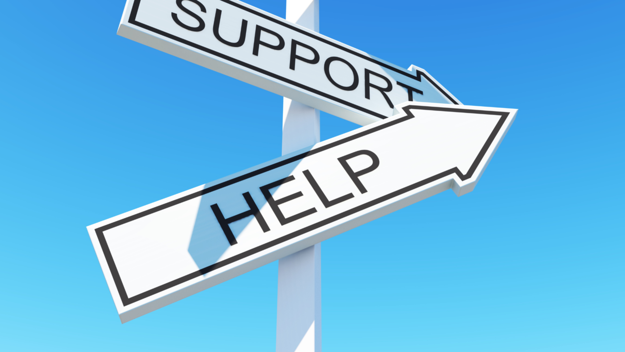 Zwei Wegweiser auf denen "Support" und "Help" steht